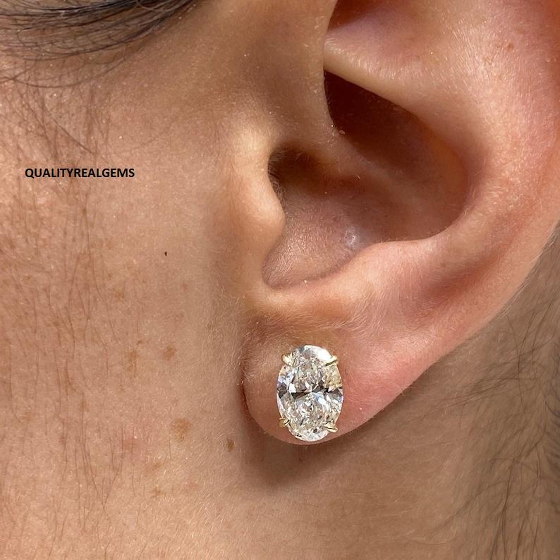 thumbnail interactive-video image 1 of 2 Ct Round Moissanite Stud Earrings – 14k White Gold – GRA Certified – Marcos Jewelers USA 1 of 4