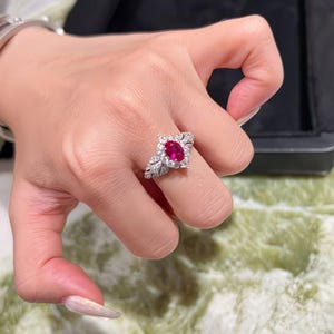 2 Ct Oval Cut lab grown Red Ruby & Moissanite studded Ring with Heavy-duty Prong-setting Made in 925 Sterling Silver.
