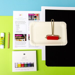 May include: A set of art supplies for creating a collage. The supplies include a pair of scissors, glue stick, pencil, a roller, a white plate, black paper, white paper, and a set of acrylic paints in a box. The instructions for creating a collage are printed on a sheet of paper.