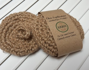 2-pack of eco-friendly pot scrubbers (round); eco-friendly sponge; pot scrubber; environmentally friendly kitchen helper; dish sponge; sustainable product