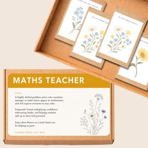 May include: A brown cardboard gift box containing several seed packets with floral illustrations. The box lid features the text MATHS TEACHER, a definition of a maths teacher, and a line drawing of wildflowers. The seed packets show various flowers.