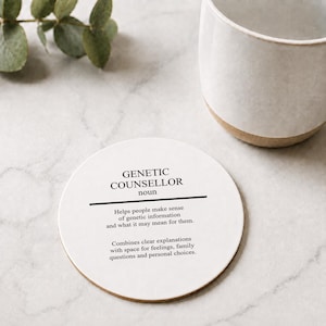 May include: A round white coaster featuring black text that defines a genetic counsellor as someone who helps people make sense of genetic information, combines clear explanations with space for feelings, family questions, and personal choices.