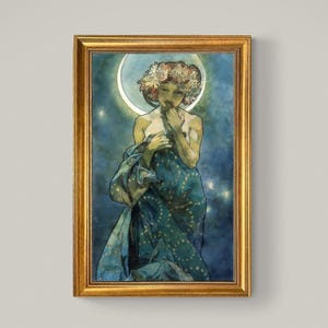 May include: A framed art print depicting a woman with a floral crown and a flowing blue gown. The artwork has a celestial theme, with a crescent moon and stars in the background. The frame is gold.