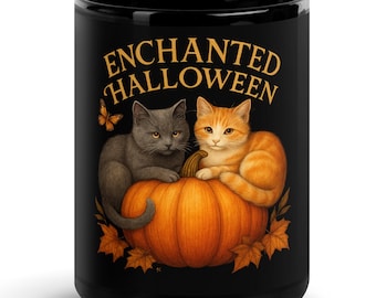 May include: A black ceramic mug featuring a graphic of a grey cat and an orange tabby cat sitting on a large orange pumpkin. The text ENCHANTED HALLOWEEN is printed in gold above the cats, surrounded by orange autumn leaves and a small butterfly.