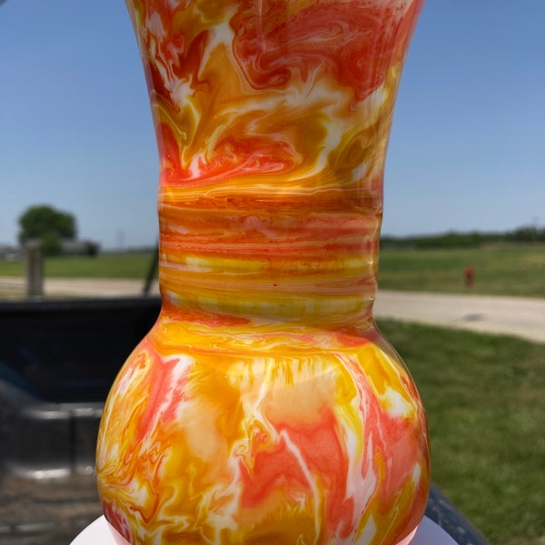 6.5in tall glass vase designed with alcohol ink. Colors: sunshine yellow, peach Bellini and coral.