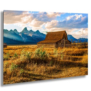 Historic Barn With Tetons in Background Taken on Private Land in Grand Teton National Park at Sunset With Long Shadows and Golden Light