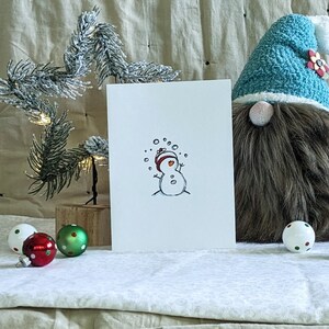 Cartão de boneco de neve do país das maravilhas do inverno | Cartão de boneco de neve personalizado | Cartão de Natal feito à mão com boneco de neve | Cartões de felicitações de Natal exclusivos |