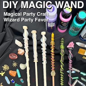 May include: A white ceramic mug with a black handle and the text "But First, Coffee" in a bold, black font. The mug is set against a blurred background, suggesting a cozy setting.