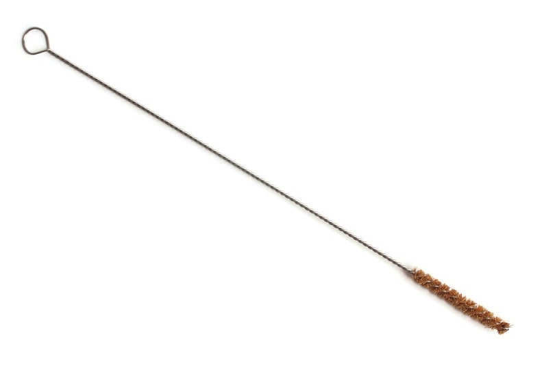 May include: A long, thin cleaning brush with a brown bristle head and a metal wire handle with a loop at the end.