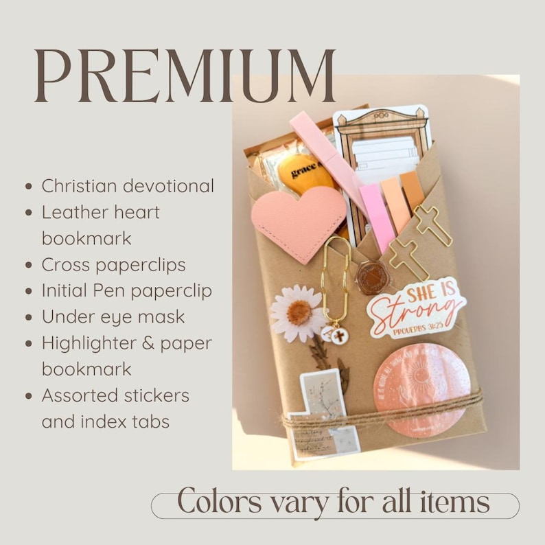 May include: A brown paper package containing a Christian devotional, a pink leather heart bookmark, gold cross paperclips, an initial pen paperclip, an under eye mask, highlighters, paper bookmarks, assorted stickers, and index tabs. The text reads PREMIUM.