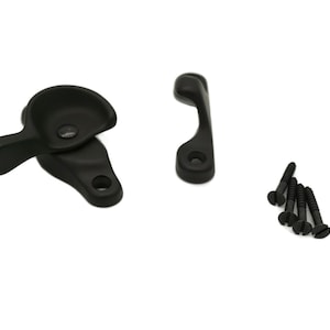 May include: Black window latch with a lever handle and a separate black latch. The latch comes with black screws.