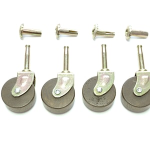 May include: Set of four brown wooden furniture casters with metal stems and mounting plates. The casters are designed for use on furniture legs and have a smooth rolling surface.