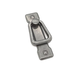 May include: A silver-toned cabinet pull with a square base and a ring-shaped handle.