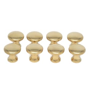May include: Eight gold-colored cabinet knobs with a rounded top and a short, cylindrical base. The knobs are arranged in two rows of four, against a white background. These knobs are suitable for furniture.