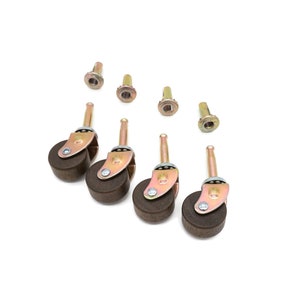 May include: Five brown wooden furniture casters with metal stems and screws. The casters are designed for use on furniture legs.