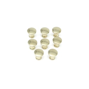 May include: Ten gold-toned cabinet knobs with a round, slightly domed top and a short, cylindrical base.