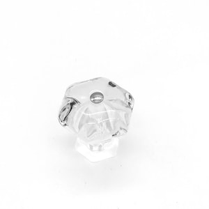 May include: A clear glass cabinet knob with a hexagonal shape and a raised center.