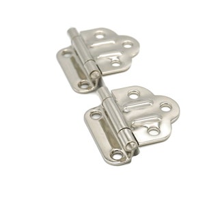 May include: Two silver-toned, decorative hinges with a butterfly-shaped design. The hinges are connected and ready to be installed.