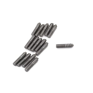 May include: A group of silver-colored screws with a threaded design. The screws are arranged in a loose pile on a white background.
