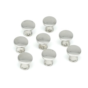 May include: A collection of eight shiny, silver-colored cabinet knobs. Each knob has a rounded, flat top and a short, cylindrical base. The knobs are arranged on a white background.