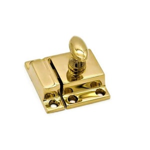 May include: A polished brass cabinet latch with an oval-shaped knob. The latch has a rectangular base and a spring-loaded mechanism.