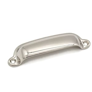 May include: A polished nickel cabinet pull with a rounded rectangular shape and two mounting holes.