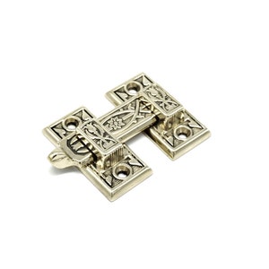 May include: A decorative, antique-style brass hinge with intricate floral and geometric patterns. The hinge is composed of two rectangular plates connected by a central bar, with a lever for opening and closing. The hardware is set against a white background.