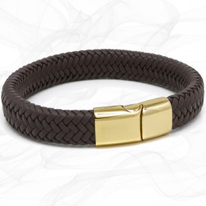 May include: A brown leather braided bracelet with a gold metal clasp.
