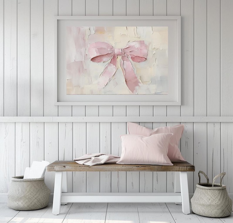 May include: A framed painting of a pink bow on a textured background. The bow is tied with a large, soft loop and the background is a mix of light pink, cream, and white.