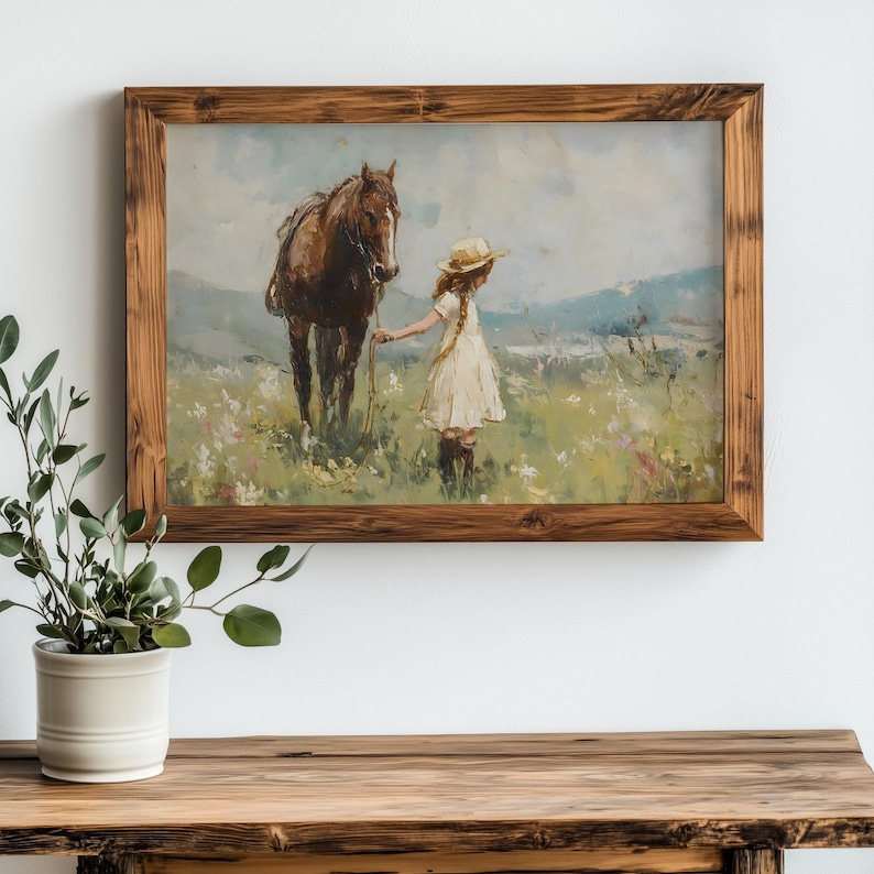 May include: A framed painting of a young girl in a white dress and straw hat walking with a brown horse in a field of wildflowers.