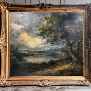 May include: A framed oil painting depicting a landscape scene with a large tree in the foreground, a lake in the middle ground, and rolling hills in the background. The sky is cloudy and the colours are muted.