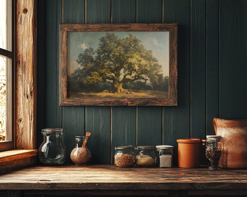 May include: A framed painting depicting a large oak tree with green leaves in a woodland setting. The painting is hung on a dark green wall with wood panelling. Several glass jars and a ceramic jar are arranged on a wooden shelf below the painting.