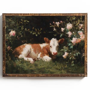 May include: A framed painting of a brown and white calf resting in a grassy area surrounded by pink roses and green foliage. The artwork has a rustic, vintage aesthetic with a dark background.
