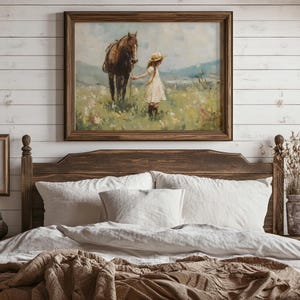 May include: A framed painting of a young girl in a white dress and a straw hat, holding the reins of a brown horse in a field of wildflowers.
