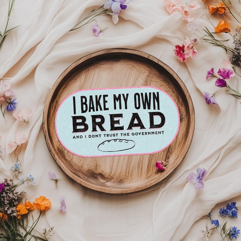 May include: A wooden serving tray with a light blue and white sticker that says "I bake my own bread and I don't trust the government".