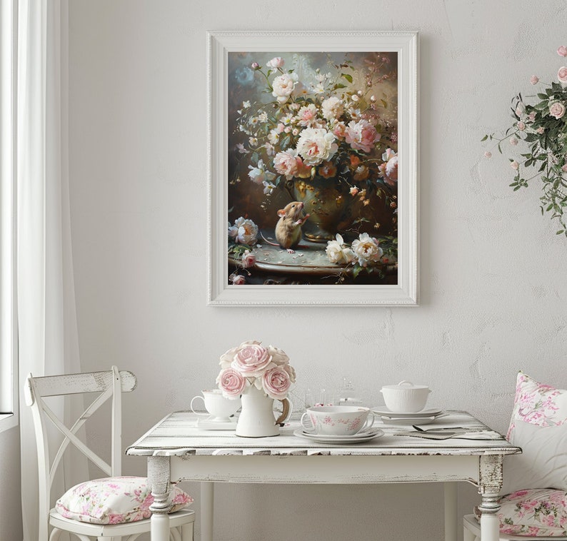 May include: A framed painting of a vase filled with pink roses and a small mouse sitting on a table. The vase is decorated with gold accents and the table is covered in a white tablecloth.