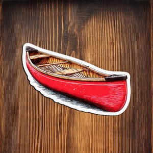 May include: A red canoe sticker with a white border featuring a detailed illustration of the boat's interior, including wooden benches and ribs, with black accents at the bow and stern, presented in a high-contrast, hand-drawn artistic style.