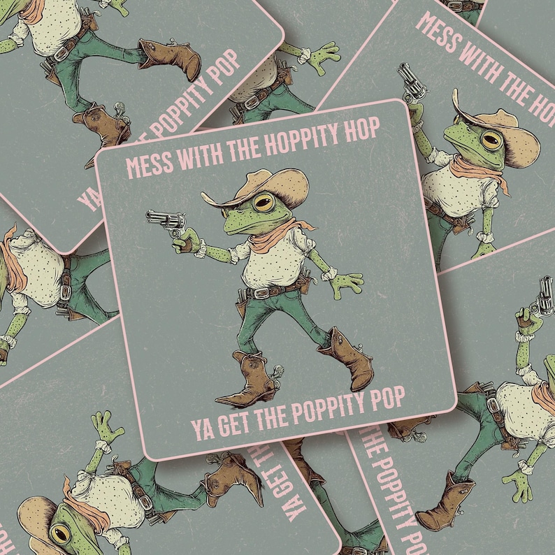 May include: A square sticker featuring a green frog dressed as a cowboy, wearing a tan hat, a white shirt with dark spots, and brown boots. The frog holds a silver revolver. The text reads: MESS WITH THE HOPPITY HOP YA GET THE POPPITY POP.