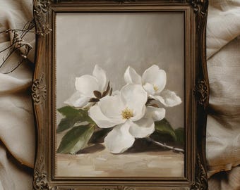 May include: A framed painting of white magnolia blossoms with green leaves against a light brown background.
