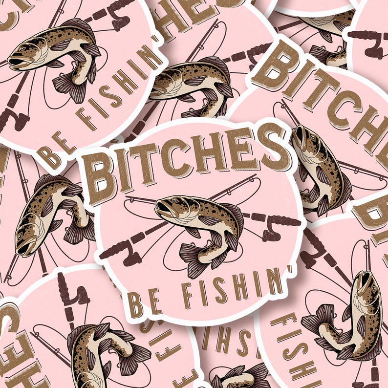 May include: Pink sticker with a brown fish and fishing rods, with the text "Bitches Be Fishin'" in brown lettering.