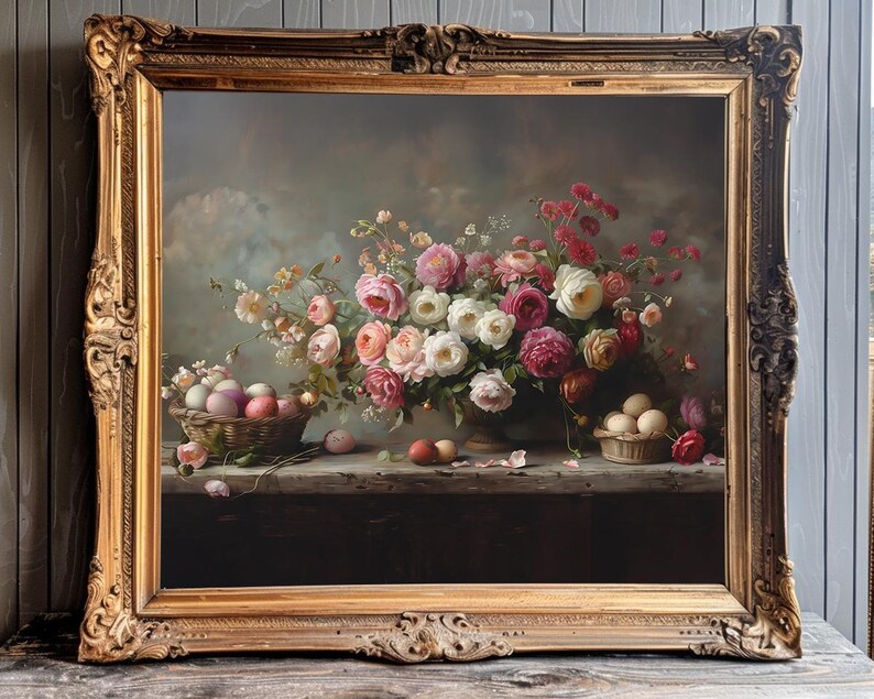 May include: A still life painting in a gold frame shows a bouquet of pink, white, and red roses in a vase. The roses are surrounded by green leaves and stems. There are also several eggs in a basket on the table.