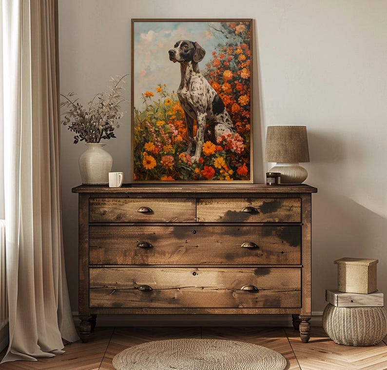 May include: A framed painting of a black and white spotted dog sitting in a field of orange and yellow flowers. The dog is looking to the left of the image.