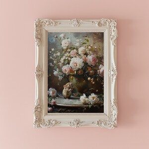 May include: A framed painting of a bouquet of white roses in a vase with a small mouse sitting on a table in front of the vase.