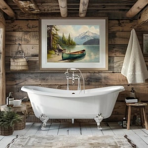May include: A clawfoot bathtub with ornate silver feet is the focal point of a rustic bathroom. A framed landscape painting hangs above the tub. A small wooden stool and a potted plant add to the cozy atmosphere.