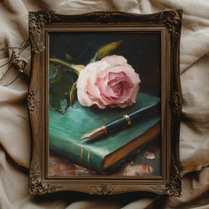 May include: A painting of a pink rose and a fountain pen on top of a green book. The book is closed and has gold accents.