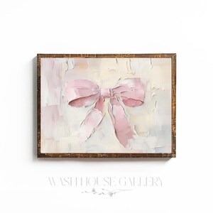 May include: A framed painting of a pink bow on a white and cream background. The bow is painted in a textured style, giving it a three-dimensional look.