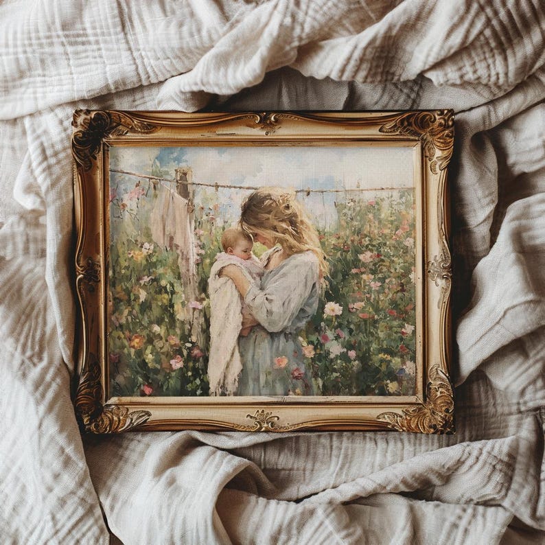 May include: A framed painting of a mother and child in a garden setting. The mother is holding the child in her arms and they are both looking down. The painting is done in a soft, muted palette of greens, blues, and pinks.