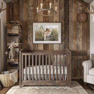May include: A rustic wooden crib with a white mattress and a brown and white checkered crib skirt. The crib is in a room with a wooden wall and a framed picture of a woman holding a baby.