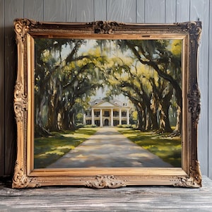 May include: A framed oil painting depicting a white plantation house with a long driveway lined with moss-draped oak trees. The house has a white columned porch and a large lawn.