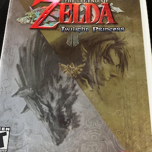 May include: The Legend of Zelda: Twilight Princess Wii game case. The cover features the game's title in red and the image of a wolf and a character's profile. The Nintendo logo is in the bottom right corner.